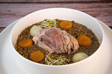 Recipe for salted pork shank with lentils. High quality photo