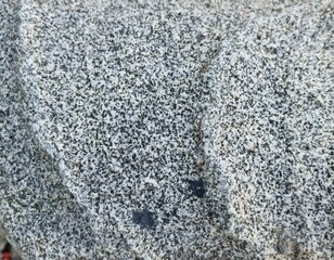 Fondo natural con detalle y textura de piedra de granito con formas curvas y degradado de tonos grises