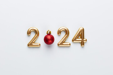 New year 2023 number, golden digits and santa hat over blue background.