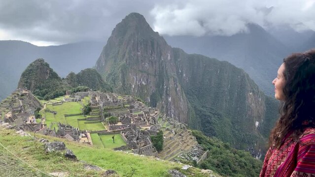 General view of Inca Citadel called Machupichu built of stones in the mountain, cloudy day, Peru