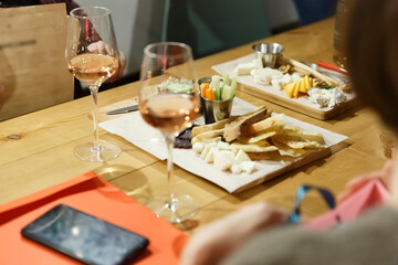 Meeting friends in a restaurant or cafe with wine and snacks