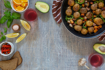 Large fried piece of ham meat in a pan with vegetables and spices, American lunch fried piece of meat and potatoes, beans in sauce and snacks, copy space for text