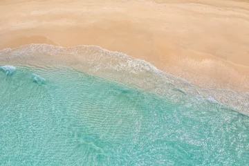  Summer seascape beautiful waves, blue sea water in sunny day. Top view from drone. Sea aerial view, amazing tropical nature background. Beautiful bright sea waves splashing and beach sand sunset light © icemanphotos