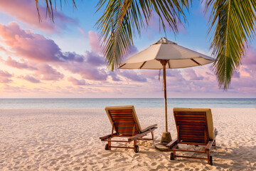 Fototapeta premium Fantastic beach. Couple chairs sandy beach sea. Luxury summer holiday and vacation resort hotel for tourism. Inspirational tropical landscape. Tranquil scenery, relax beach, beautiful landscape design