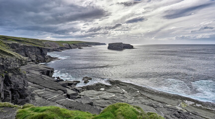 Wild cliffs near Dunmore Head at the Ring of Kerry, Atlantic water way in County Kerry, Republic of Ireland