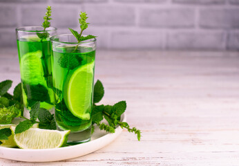 Delicious mint liqueur with lime and green mint leaves.Copy space.
