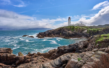 Fanad Head Lighthouse with its rough cliffs in the northern part of Republik of Ireland