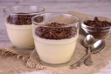 Vanilla dessert with grated chocolate. Vanilla pudding.

