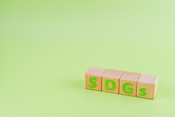 SDGs - sustainable development goals word concept on cubes