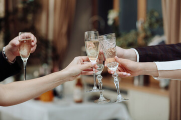 friendly clinking of glasses after a toast. Celebration of a solemn event or holiday, birthday or wedding.