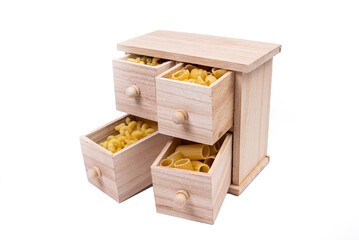 Different types of italian uncooked pasta in wooden box, whole wheat pasta, pasta, spaghetti, noodles, tagliatelle. Top view