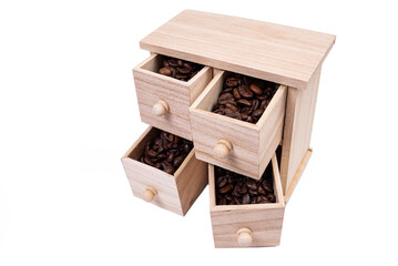 Wooden box with cells filled with coffee beans. Coffee beans scattered side by side Isolated on white background