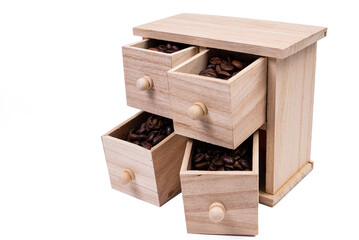 Wooden box with cells filled with coffee beans. Coffee beans scattered side by side Isolated on white background