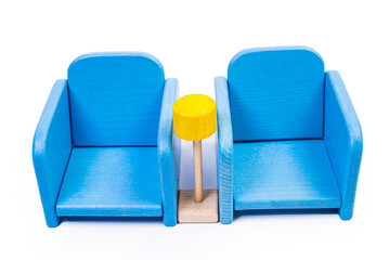 a wooden blue toy chair, a sofa, two chairs with a table, a yellow table, blue upholstered wooden chairs. yellow lamp on isolated white background