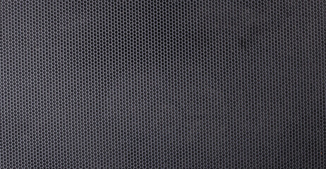 Fine mesh plastic mesh for texture and background. Black background of pentagonal cells - honeycombs.