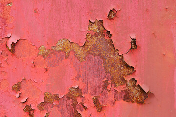 old rusted metal with scratched red paint