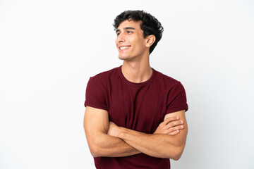 Young Argentinian man isolated on white background happy and smiling