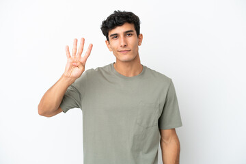 Fototapeta premium Young Argentinian man isolated on white background happy and counting four with fingers