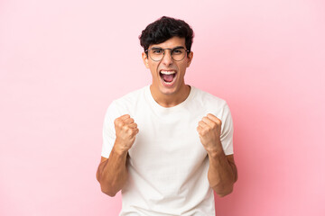 Young Argentinian man isolated on pink background frustrated by a bad situation