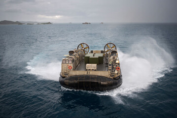 Huge military boat carrying military vehicles and ammunition