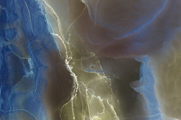 Alcohol ink abstract colorful background. Contrasting acrylic paint waves in water. Texture of dark marble. Pattern for printing. Vibrant stains and splashes