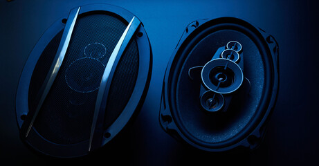 Black car sound speakers close-up on a black background, audio system, hard bass subwoofer