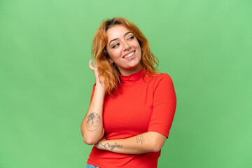 Young caucasian woman isolated on green screen chroma key background thinking an idea