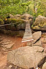 Moving rope bridge in the mountains