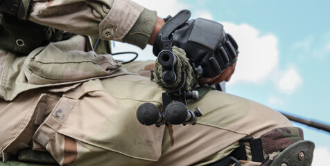 Fototapeta na wymiar Aimed rifle of a soldier in a transport