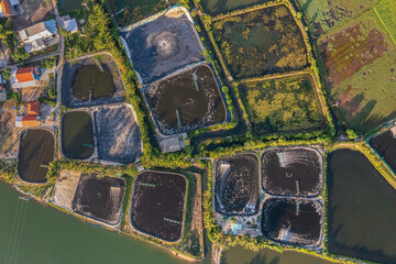 Aerial view of the Shrimp ( Prawn ) farm with aerator pump in Tam Ky, Quang Nam, Vietnam. The growing aquacuture business continuously  for export to China, Korea, Japan, America, Europe