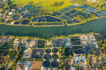 Aerial view of the Shrimp ( Prawn ) farm with aerator pump in Tam Ky, Quang Nam, Vietnam. The growing aquacuture business continuously  for export to China, Korea, Japan, America, Europe