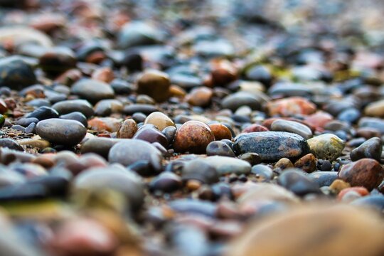 Closeup shot of the colourful pebbles on the beach of Lake Ontario