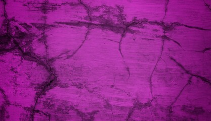 Obraz premium A textured purple concrete wall with a prominent vertical crack. 