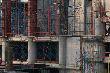 Fototapeta na wymiar High rise construction site office building with crane
