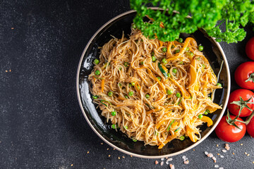 rice noodles with vegetables Asian dish fresh delicious snack healthy meal food snack diet on the table copy space food background rustic top view keto or paleo diet veggie vegan or vegetarian food 