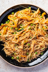 rice noodles with vegetables Asian dish fresh delicious snack healthy meal food snack diet on the table copy space food background rustic top view keto or paleo diet veggie vegan or vegetarian food 