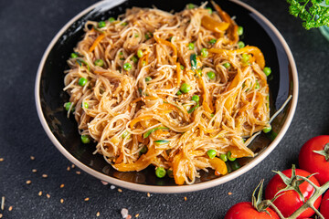 rice noodles with vegetables Asian dish fresh delicious snack healthy meal food snack diet on the table copy space food background rustic top view keto or paleo diet veggie vegan or vegetarian food 