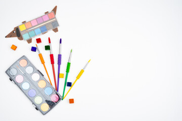 Creative background with colorful brushes. Symbols of the home, the earth, the disclosure of talent, freedom of expression, the nature of the artist.