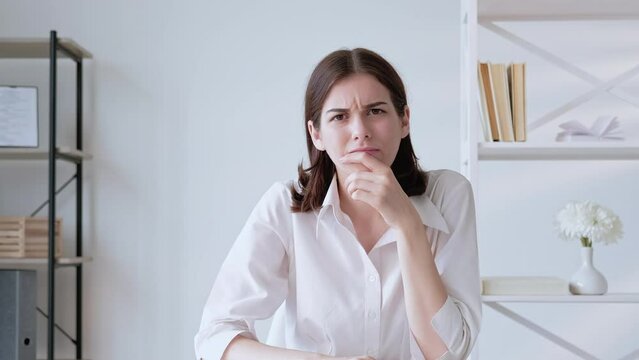 Disappointing meeting. Virtual call. Interview failure. Dissatisfied tired skeptic business woman rejecting offer in virtual office with free space. Long video shot.