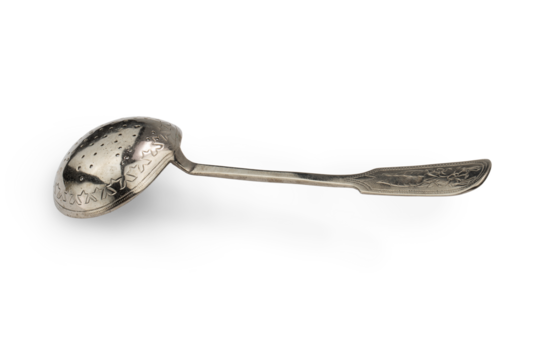 antique silver spoon-strainer for tea, isolated