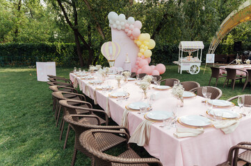 On the table is a decorative vase with dried flowers. Beautiful summer location for relaxation
