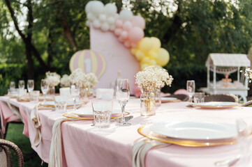 On the table is a decorative vase with dried flowers. Beautiful summer location for relaxation