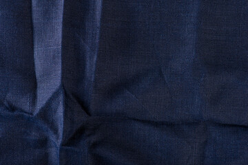 Texture of fabric for furniture upholstery. Wear and water resistant fabric in deep folds top view....