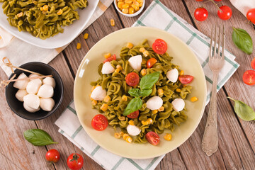 Fusilli pasta with cherry tomatoes and sweet corn.