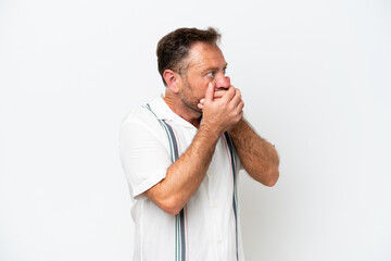 Middle age caucasian man isolated on white background covering mouth and looking to the side