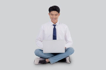 Young asian business man sitting work on laptop computer to internet online isolated on white background, businessman confident and notebook, freelance with success, marketing and communication.