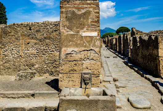 public fountain in the streets of Pompeii, Pompeii was destroyed, and completely buried, during a long catastrophic eruption of the volcano Mount Vesuvius spanning two days in 79 AD.