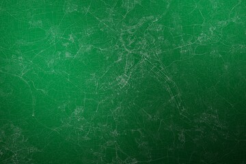 Map of the streets of Stuttgart (Germany) made with white lines on abstract green background lit by two lights. Top view. 3d render, illustration