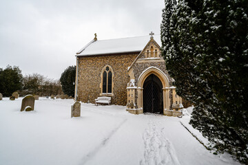 All Saints church in the small village of Sutton in the British countryside, it is totally covered...