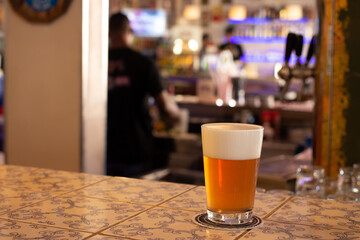 cold beer mug on a bar counter
